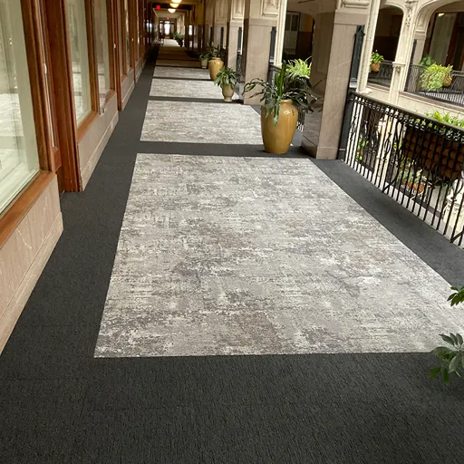 Grover arcade hallway commercial carpet installation grey patterns and black border